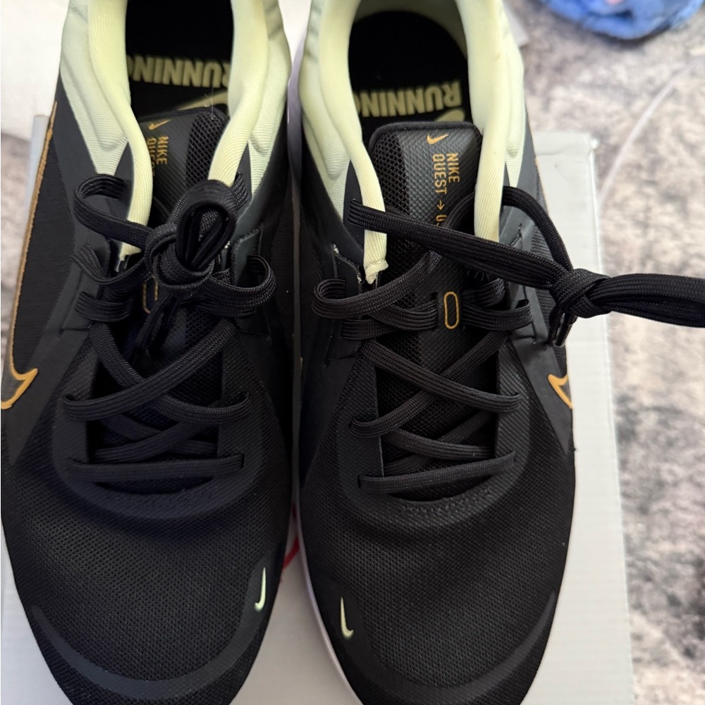 Black and Gold Sleek Sneakers with Modern Design